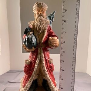 10 in Resin Santa Figurine w/wood looking base